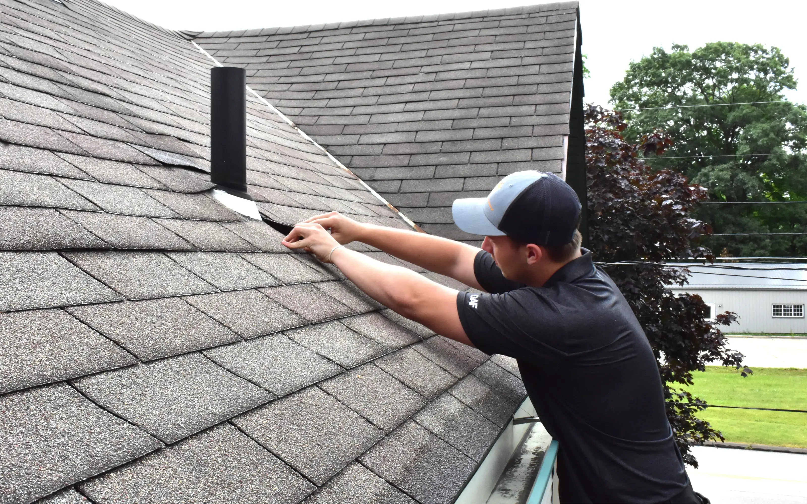 Alex Shestov is inspecting the roof for further restoration after recent damage