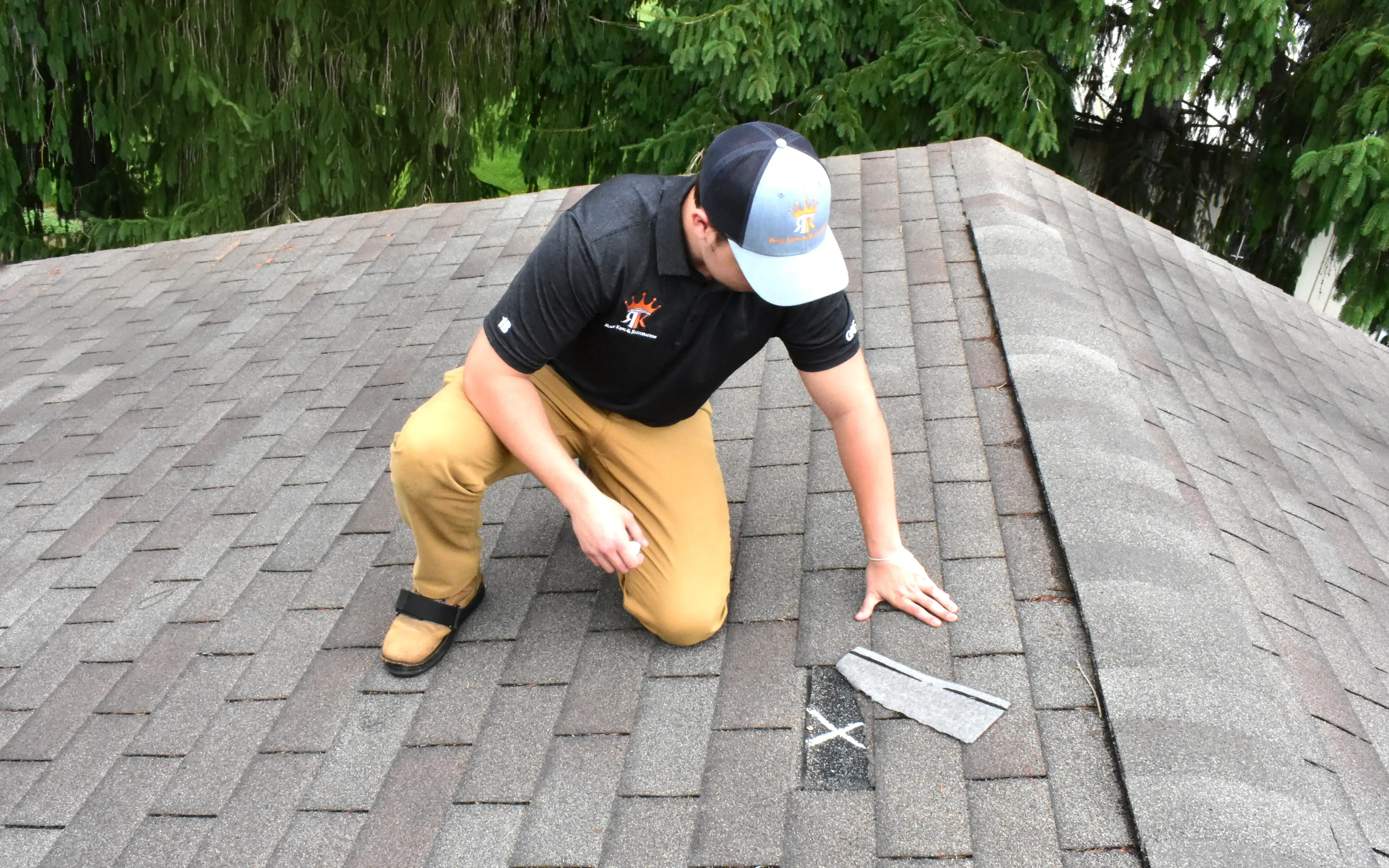 Alex Shestov points out damaged areas of the roof for further restoration after recent damage